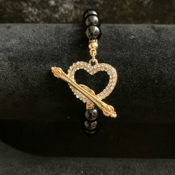 Bracelet with heart-shaped charm . - Picture 1 of 3